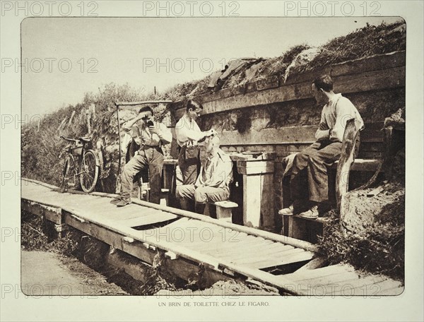 Soldiers getting shaved by barber in trench in Flanders during the First World War