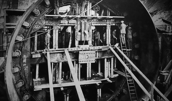 20th century workers in cylindrical tunnelling shield