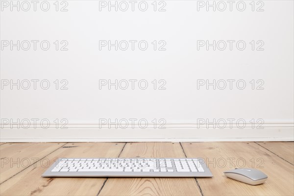 Keyboard and computer mouse on the floor