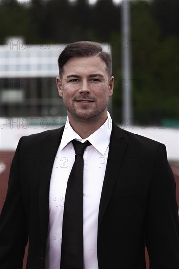 Businessman in black suit with tie