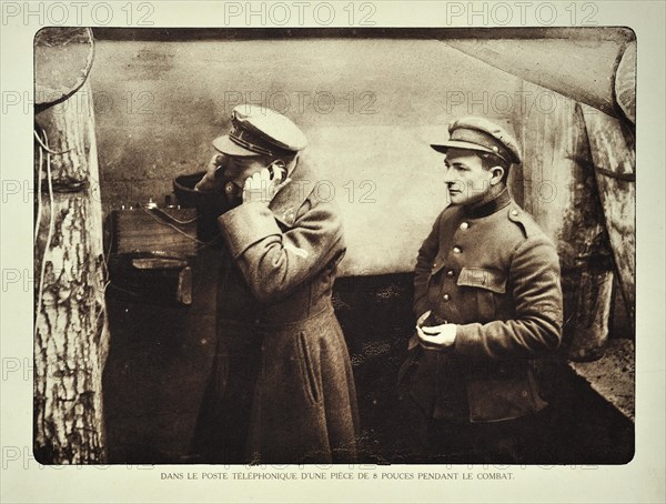 Officer in shelter using telephone at communication post in Flanders during the First World War