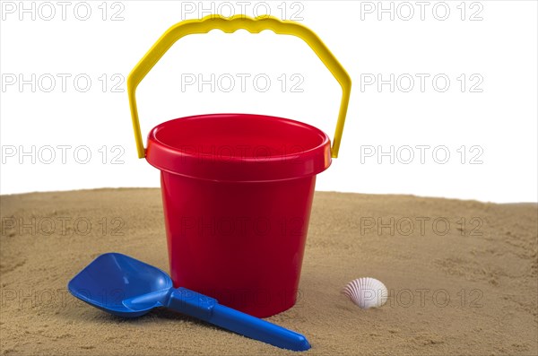 Red bucket and blue spade