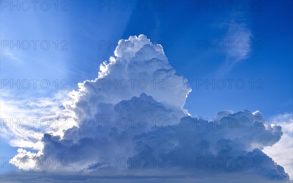 White-blue sky with thunderclouds in summer