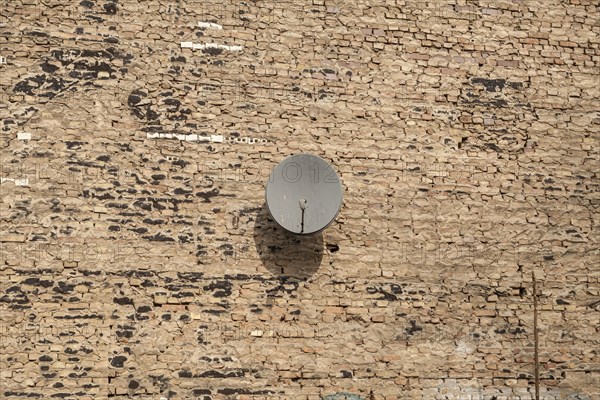 Satellite dish on a wall