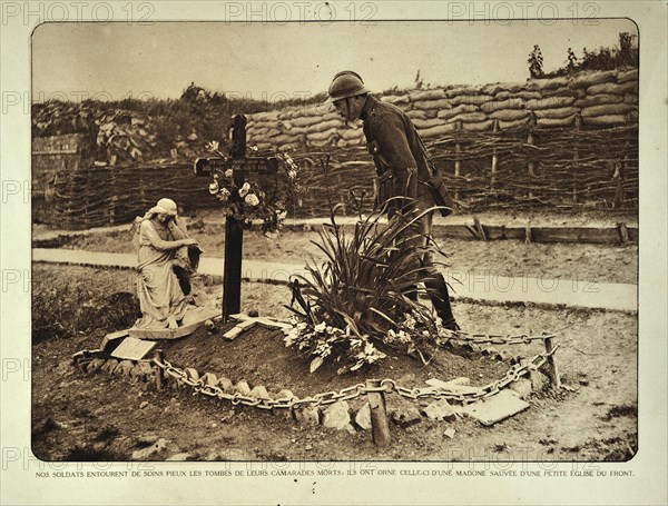 Soldier visiting grave in trench in Flanders during the First World War