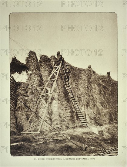 Soldiers on ladder at observation post watching the battlefield at Diksmuide in Flanders during the First World War