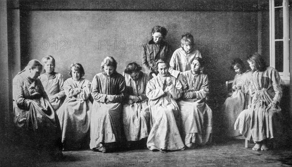 Vintage black and white photograph showing group of schizophrenic women suffering from the mental illness schizophrenia