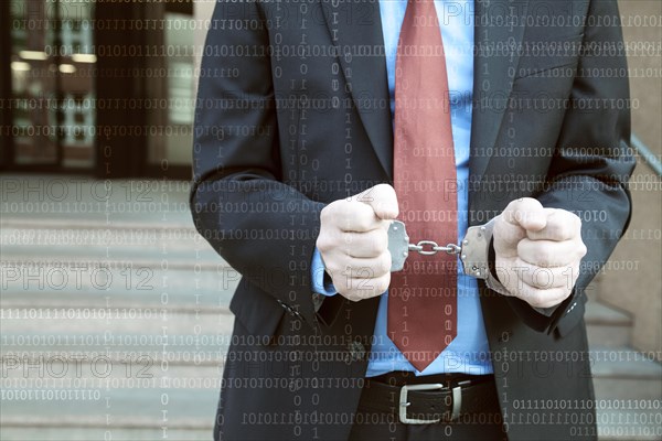 Businessman with handcuffs