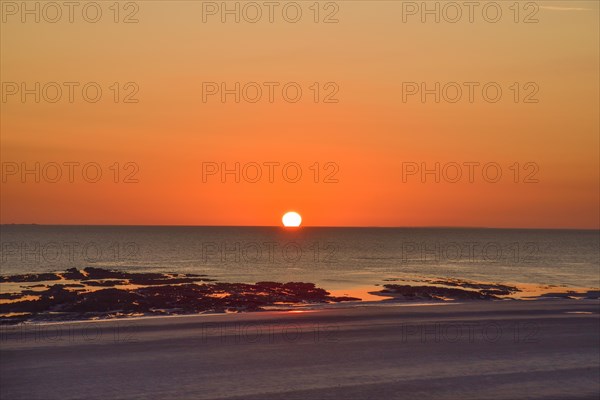 Sunset by the sea on the Cotentin Peninsula in Normandy