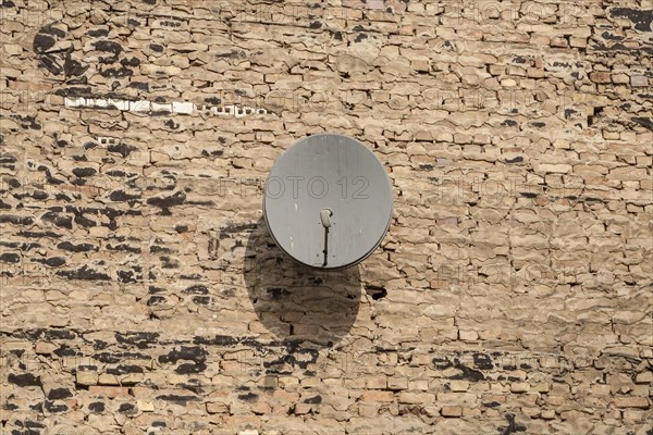 Satellite dish on a wall