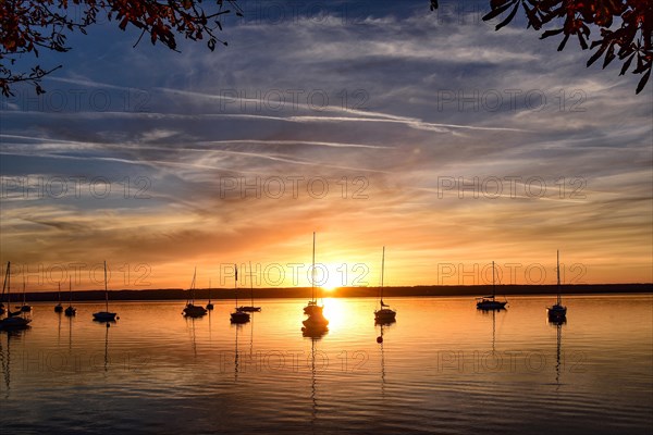 Sailing boats in the sunset in Herrschinger Bucht on Lake Lake Ammer