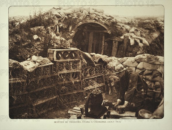 Soldier and trench mortar loaded with bomb at Kaaskerke in Flanders during the First World War