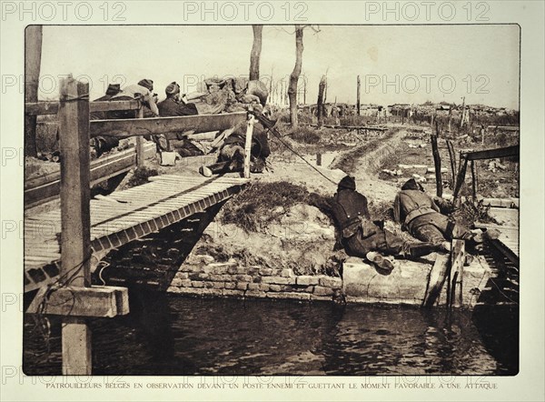 Soldiers on reconnaissance patrol observing the enemy from bridge in Flanders during the First World War