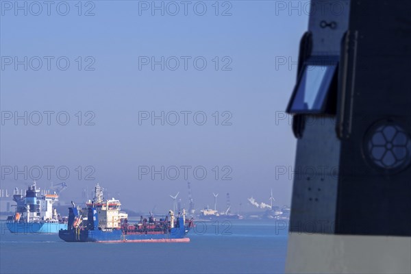 Nieuwe Sluis lighthouse near Breskens and container ship