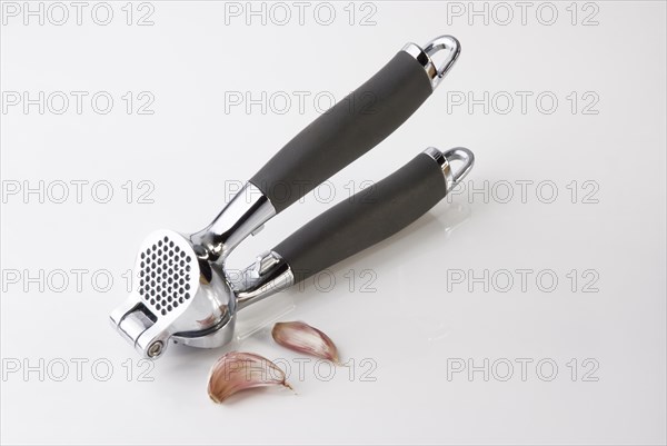 Garlic Press crushing a clove