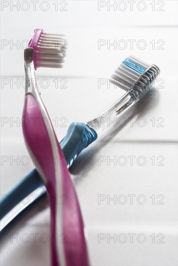 His and hers pink and blue toothbrushes