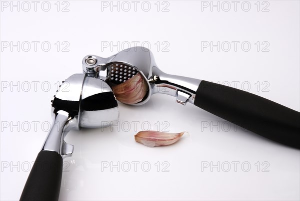 Garlic Press crushing a clove