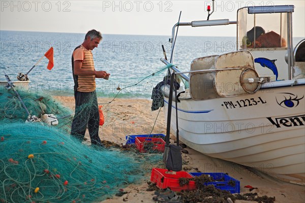 Fishing boat on the beach in Armacao de Pera