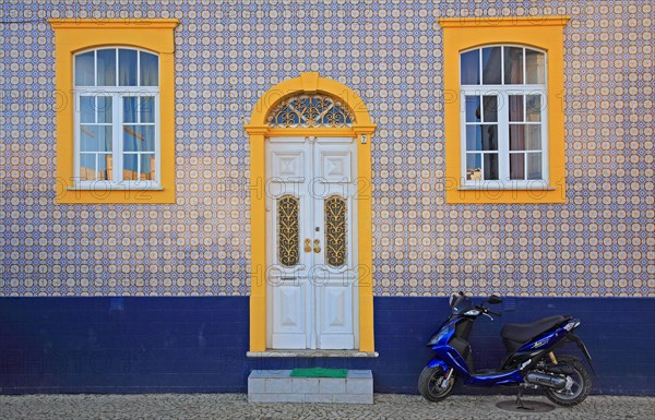 House facade with traditional azulejo tiles in Ferragudo