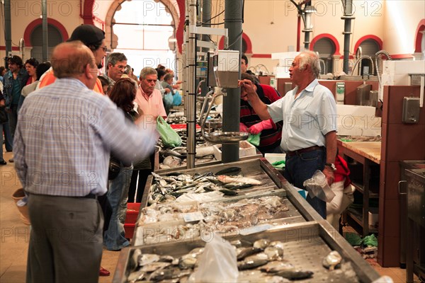 Fishmonger in the market hall in Loule