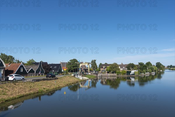 Village scene with canal bridge at the Drechterlandsdijk