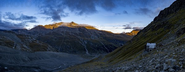 Tschierva hut above Val Rosegg and Engadine mountains at blue hour