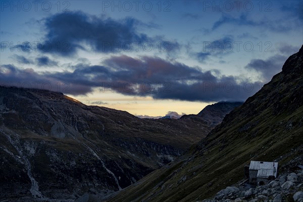 Tschierva hut above Val Rosegg and Engadine mountains at blue hour