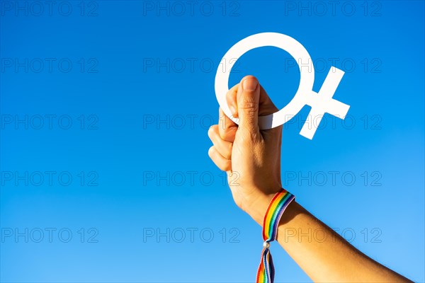 Hand of a woman with female symbol in favor of feminism