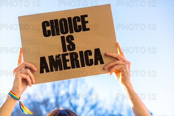 A woman holding a sign in favor of the legalization of abortion