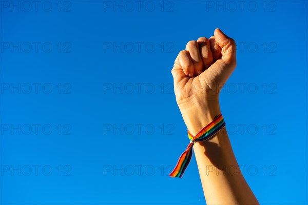 Hand of a woman with closed fist in favor of feminism
