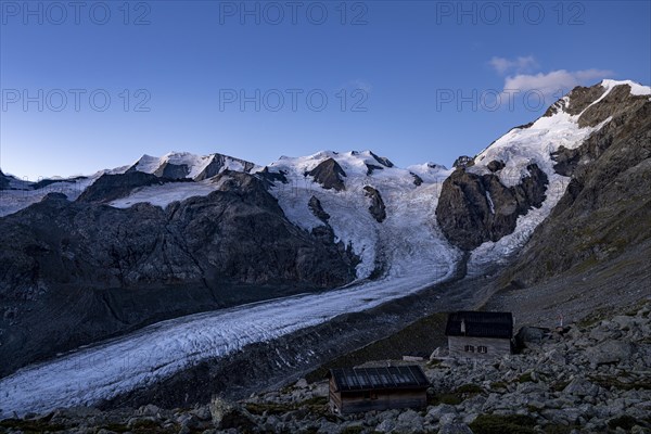 Morteratsch glacier with Boval hut in Bernina group at sunrise