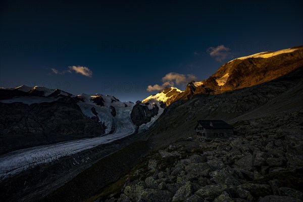 Morteratsch glacier with Boval hut in Bernina group at sunrise