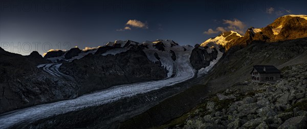 Morteratsch glacier with Boval hut in Bernina group at sunrise