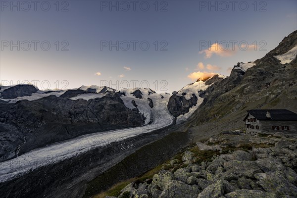 Morteratsch glacier with Boval hut in Bernina group at sunrise