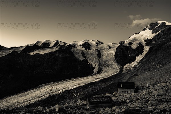 Morteratsch glacier with Boval hut in Bernina group at sunrise