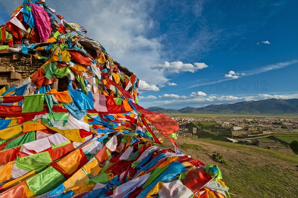 Prayer flags near Litang Tibetan Buddhist Monastery overlooking the town