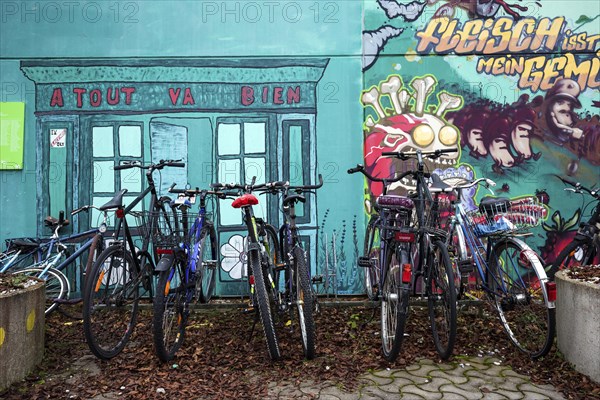Bicycles in front of mural in the former Olympic Village