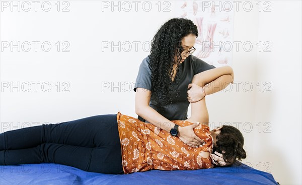 Woman doing back rehabilitation physiotherapy