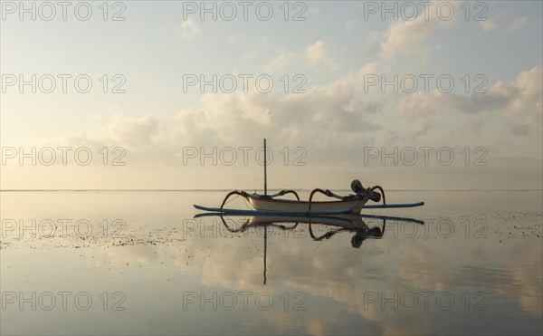 Fishing outriggers at dawn