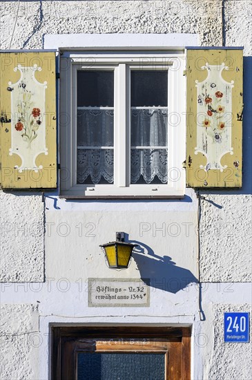 Facade of a farm with lantern and info -mentioned anno 1394- at Mariaberg