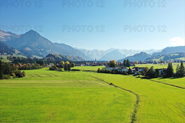 Aerial view of Fischen im Allgaeu with a view of the parish church of St Verena