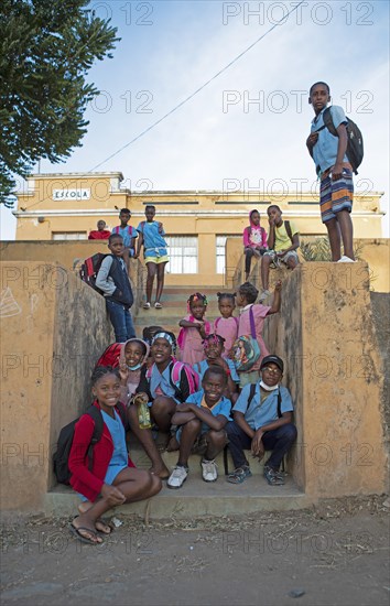 Schoolchildren in uniform in front of the village school in Rui Vaz