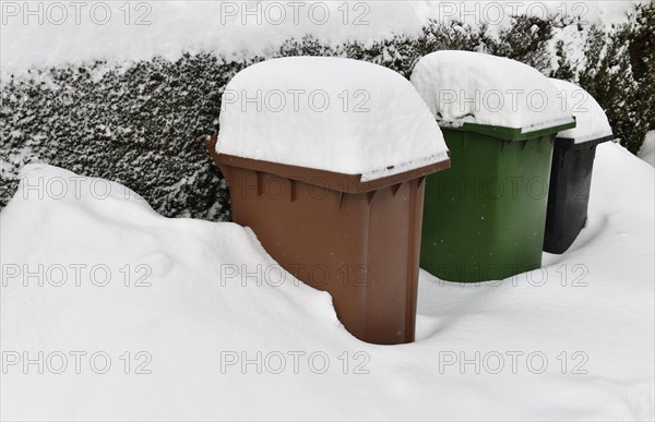 Snow-covered waste bin