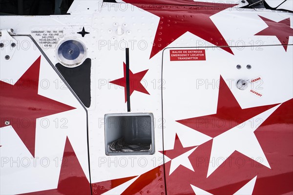 Swiss helicopter close up side view with red and white stars on chassis
