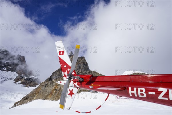 Swiss helicopter tail close up side view with red and white stars on chassis