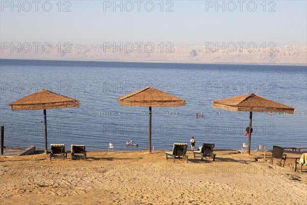 Sunshades on the sandy beach at the Dead Sea