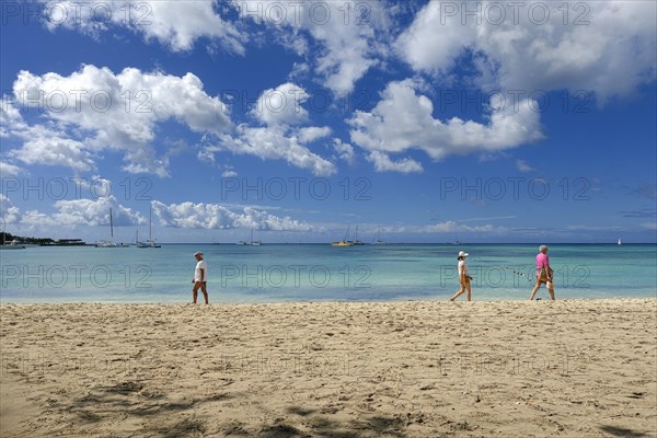 People walking on the public beach