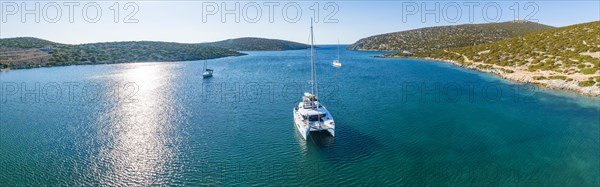 Sailing catamaran in a bay