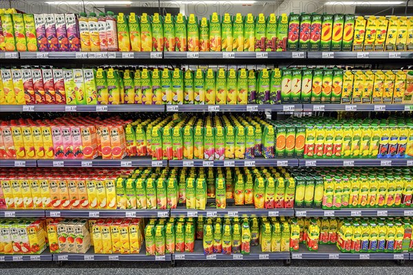 Shelves with fruit juices and drinks in the wholesale market