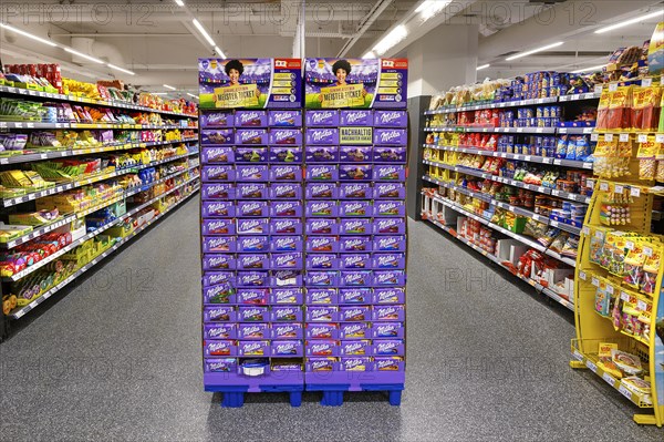 Shelves with chocolate and sweets in the wholesale market